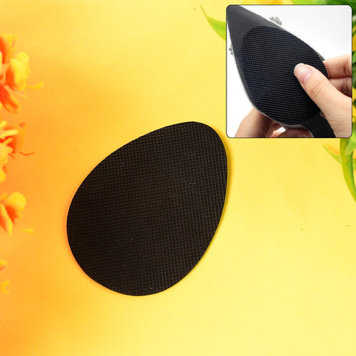 Anti-slip grip sticker applied on shoe sole for enhanced traction